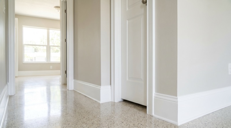 Baseboard and door casing painting with clean lines in New Smyrna Beach FL
