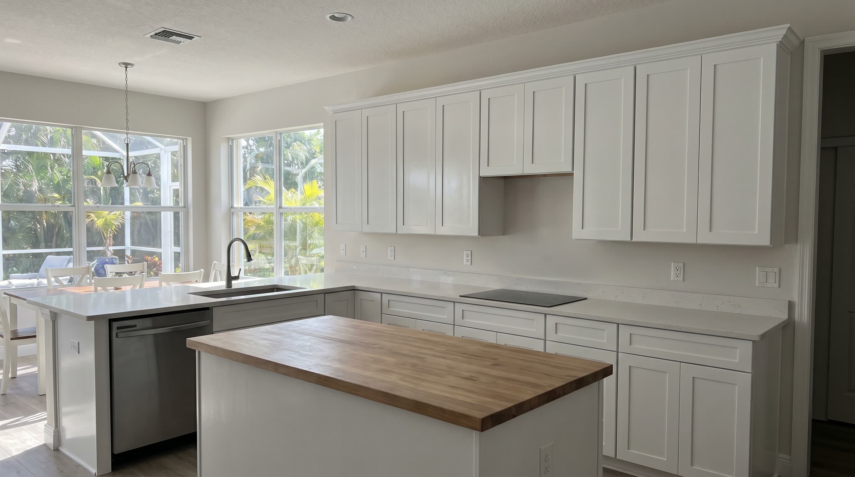 Professional cabinet painting with smooth semi-gloss finish in New Smyrna Beach FL